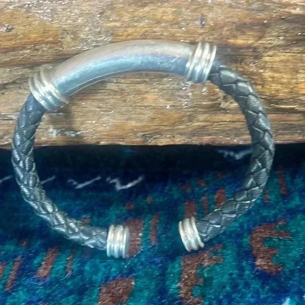 Women’s silver and black cuff bracelet.